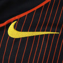 CAMISETA BARCELONA NEGRA Y NARANJA HOMBRE 25/26