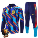 CHÁNDAL MEDIA CREMALLERA + PANTALONES ESPAÑA AZUL CAMUFLAJE Y AMARILLO 26/27 HOMBRE
