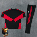 CHÁNDAL MEDIA CREMALLERA + PANTALONES MANCHESTER UNITED NEGRO Y ROJO 26/27 HOMBRE