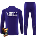 CHÁNDAL MEDIA CREMALLERA + PANTALONES COREA DEL SUR MORADO Y BLANCO 26/27 HOMBRE