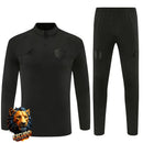 CHÁNDAL MEDIA CREMALLERA + PANTALONES MANCHESTER UNITED NEGRO 26/27 HOMBRE