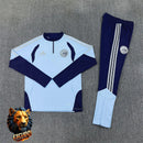 CHÁNDAL MEDIA CREMALLERA + PANTALONES AJAX AZUL CELESTE Y AZUL MARINO 26/27 HOMBRE