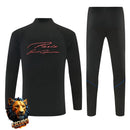 CHÁNDAL MEDIA CREMALLERA + PANTALONES PSG NEGRO Y NARANJA 26/27 HOMBRE
