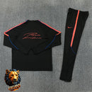CHÁNDAL MEDIA CREMALLERA + PANTALONES PSG NEGRO Y NARANJA 26/27 HOMBRE