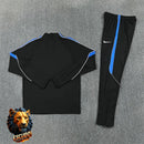 CHÁNDAL MEDIA CREMALLERA + PANTALONES ATLÉTICO DE MADRID NEGRO Y AZUL 26/27 HOMBRE